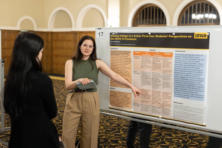 A graduate student presents their research at the 2025 Jakobsen Conference.