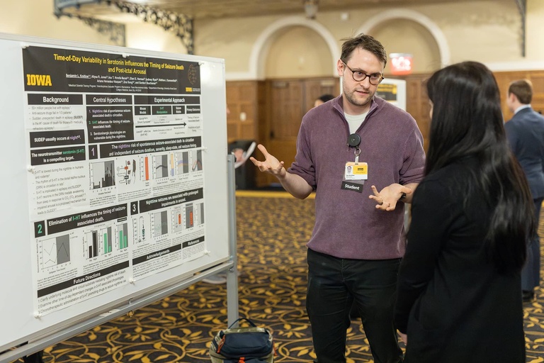A graduate student presents their research at the 2025 Jakobsen Conference.