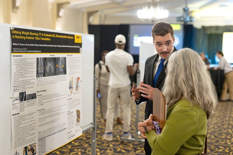 A graduate student presents their research at the 2025 Jakobsen Conference.