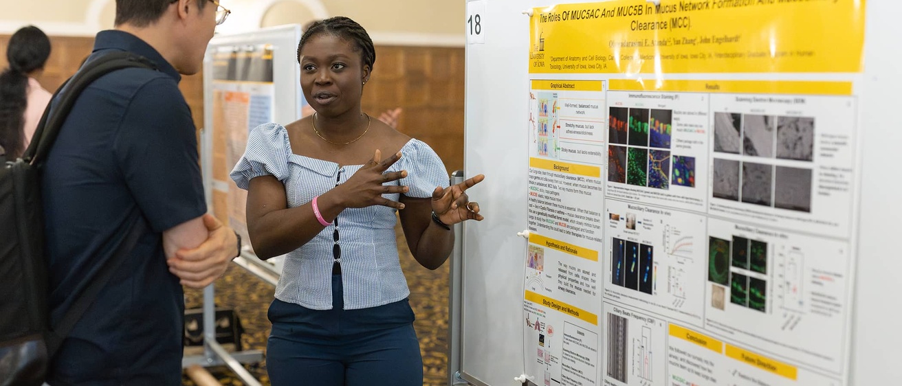 A graduate student presents their research at the 2025 Jakobsen Conference.